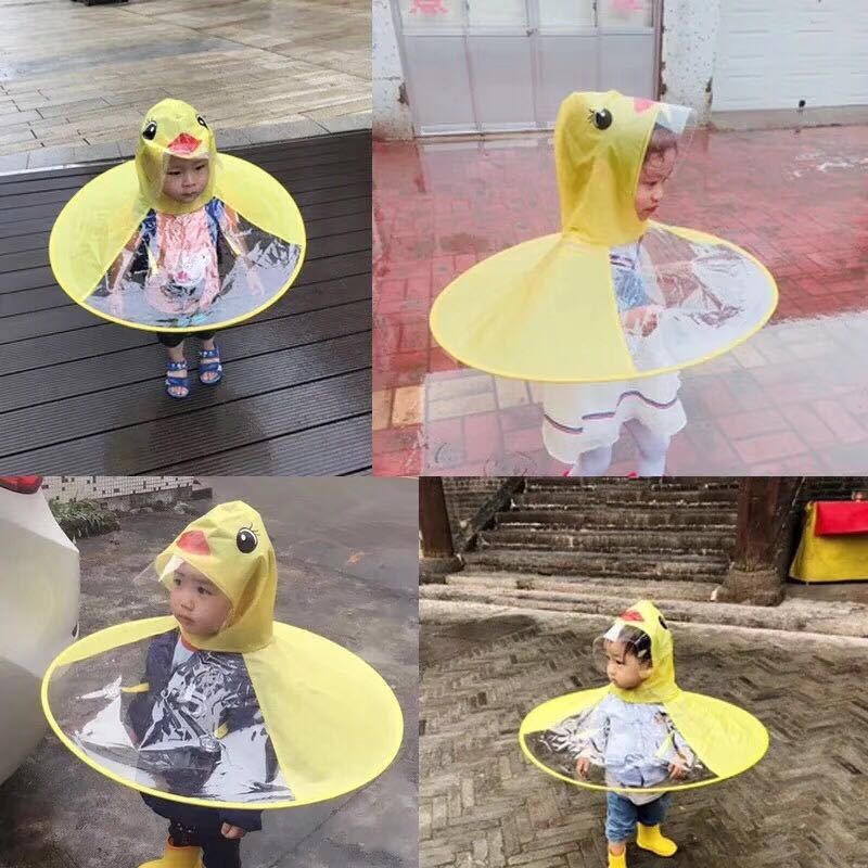 Yellow toddler raincoat with duck design, waterproof UFO umbrella hat for babies and kids, playful and protective outdoor rainwear