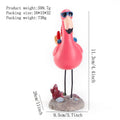 Outdoor garden gnome statue of a gnome riding a flamingo, made of resin, perfect for lawn or patio decor.