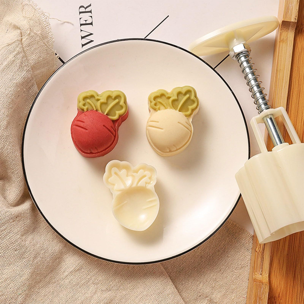 Cute carrot-shaped mooncake press mold from Everything Baby, used for making decorative Chinese Mid-Autumn mooncakes.