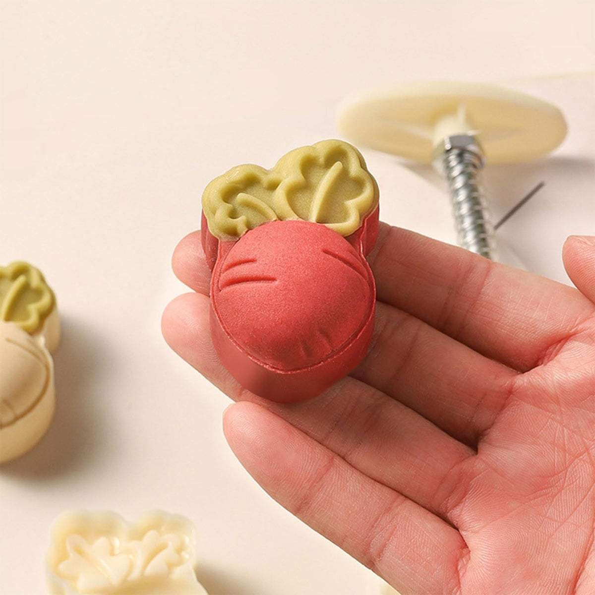 Cute carrot-shaped mooncake press mold from Everything Baby, used for making festive Chinese mooncakes and cookies.