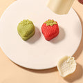 Plastic strawberry pattern mooncake mold by Everything Baby used for traditional baking and pretend play in kids' toy set.