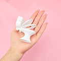 Miniature baby toilet toy from Everything Baby, featuring a tiny bathroom accessory for pretend play and dollhouse decor.