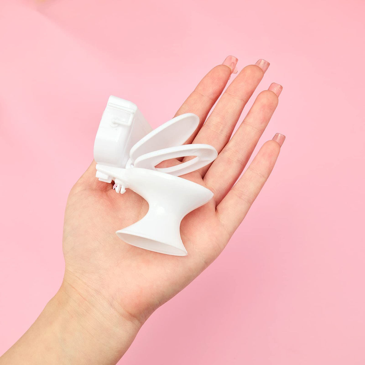 Miniature baby toilet toy from Everything Baby, featuring a tiny bathroom accessory for pretend play and dollhouse decor.