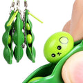 Green squeeze-a-bean soybean stress relief toy set with playful charms, ideal for keys and mobile phones, from Everything Baby.