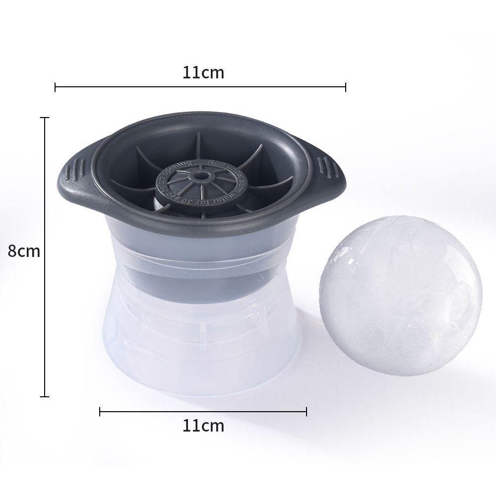 Reusable silicone ice cube molds tray with blue and grey spherical shapes, designed for making large whiskey ice balls.