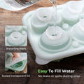 Silicone ice cube tray with rose and heart shapes, clear funnel lid, ideal for creating fun ice cubes for kids and babies.