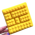 Silicone candy mold with building block shapes for making cute ice cubes, chocolates, and candies, ideal for kids' treats.