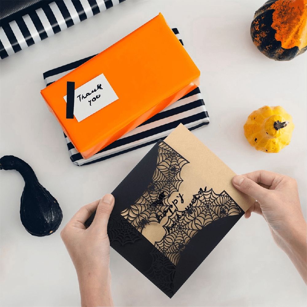 Black Halloween invitations card set with spiderweb design and bowknots, perfect for kid's spooky party invitations.