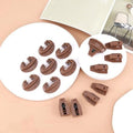 Eight sets of brown plastic drawer track guides for dresser drawers, replacement parts for center mount drawer slides.