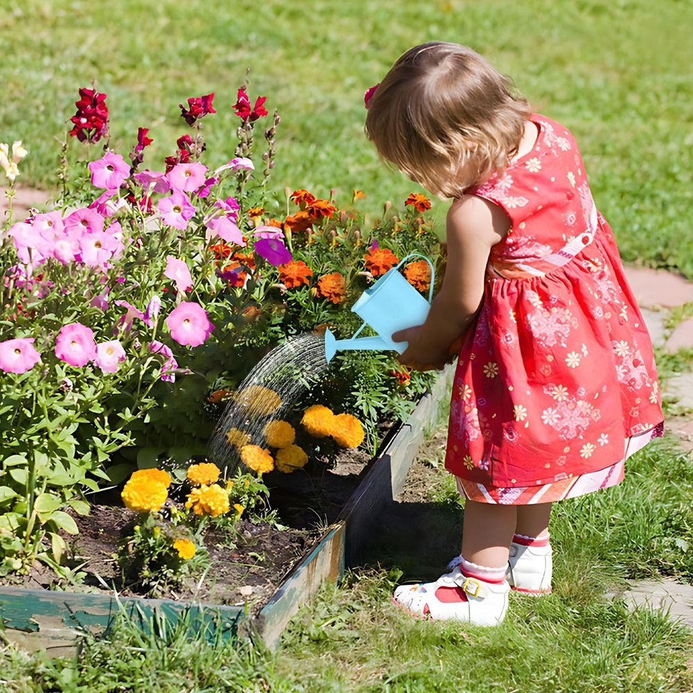 Durable Iron watering can with long spout, 600ml capacity, suitable for indoor and outdoor use, by Everything Baby.