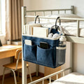 Canvas bedside caddy hanging organizer with water bottle holder for dorm or bunk beds, ideal for kids' bedroom storage.
