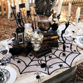 Black lace spider web round tablecloth, 40-inch Halloween table topper by Everything Baby, featuring spooky web design for festive decor.