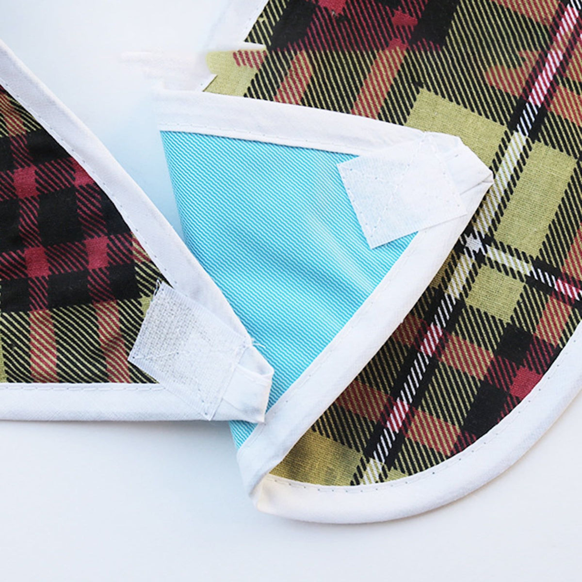 Reusable waterproof adult bib with crumb catcher, designed for women and men to protect clothing during meals.