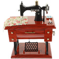 Vintage sewing machine music box toy by Everything Baby, a musical toy for kids featuring a charming sewing machine design.