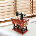 Vintage sewing machine music box toy by Everything Baby, a musical toy for kids featuring a charming sewing machine design.
