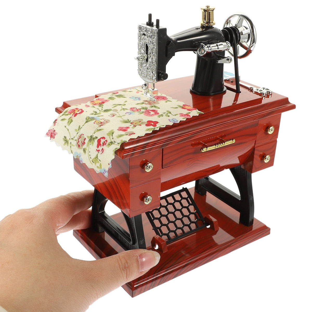 Vintage sewing machine music box toy by Everything Baby, a charming musical toy for kids and sewing enthusiasts.