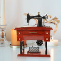 Vintage sewing machine music box toy by Everything Baby, a charming musical toy for kids and sewing enthusiasts.