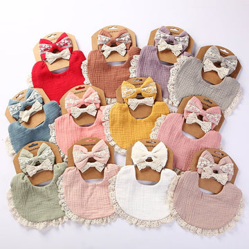 Baby girl teething drool bib with bow headband made of organic cotton, soft and breathable, multi-color baby clothing from Everything Baby.