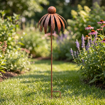 Rustic metal coneflower garden stakes set of 3, weather-resistant bronze yard art with rusted iron daisy designs for outdoor patio decor.