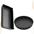Two black carbon steel baking pans with non-stick coating, ideal for pretend play baking activities for kids.