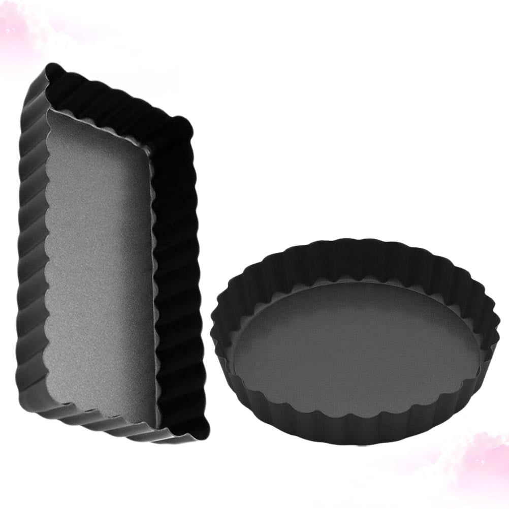 Two black carbon steel baking pans with non-stick coating, perfect for pretend play baking in a children's toy set.