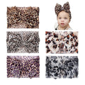 Baby girls' leopard print hair turban head wrap by Everything Baby, stretchy knotted bow headband for infants and toddlers.