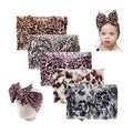 Baby girls' leopard print stretchy knot headband by Everything Baby, soft wide toddler hair turban and bow accessory for children.