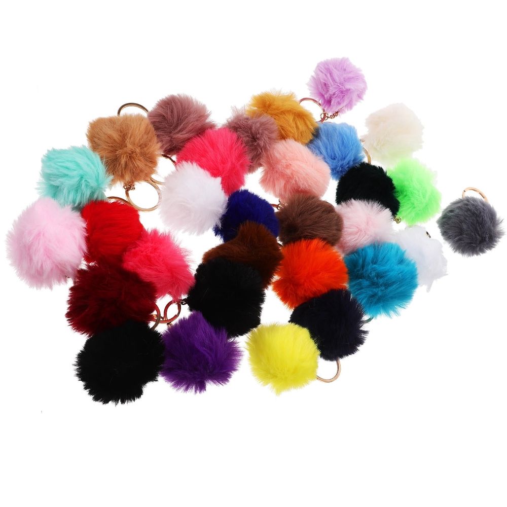 Colorful pom pom keychain set with cute bag charms and key accessories, perfect for kids and teens, by Everything Baby.