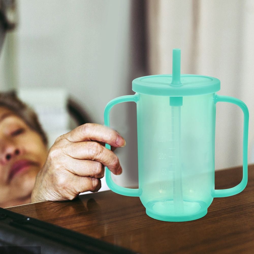 Liquid feeding cup with inclined mouth for elderly and disabled patients, designed for safe, easy feeding by Everything Baby.