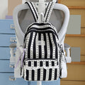 Green stripe school backpack for kids with bowknot, lace trim, spacious design, suitable for travel, college, or daily use.