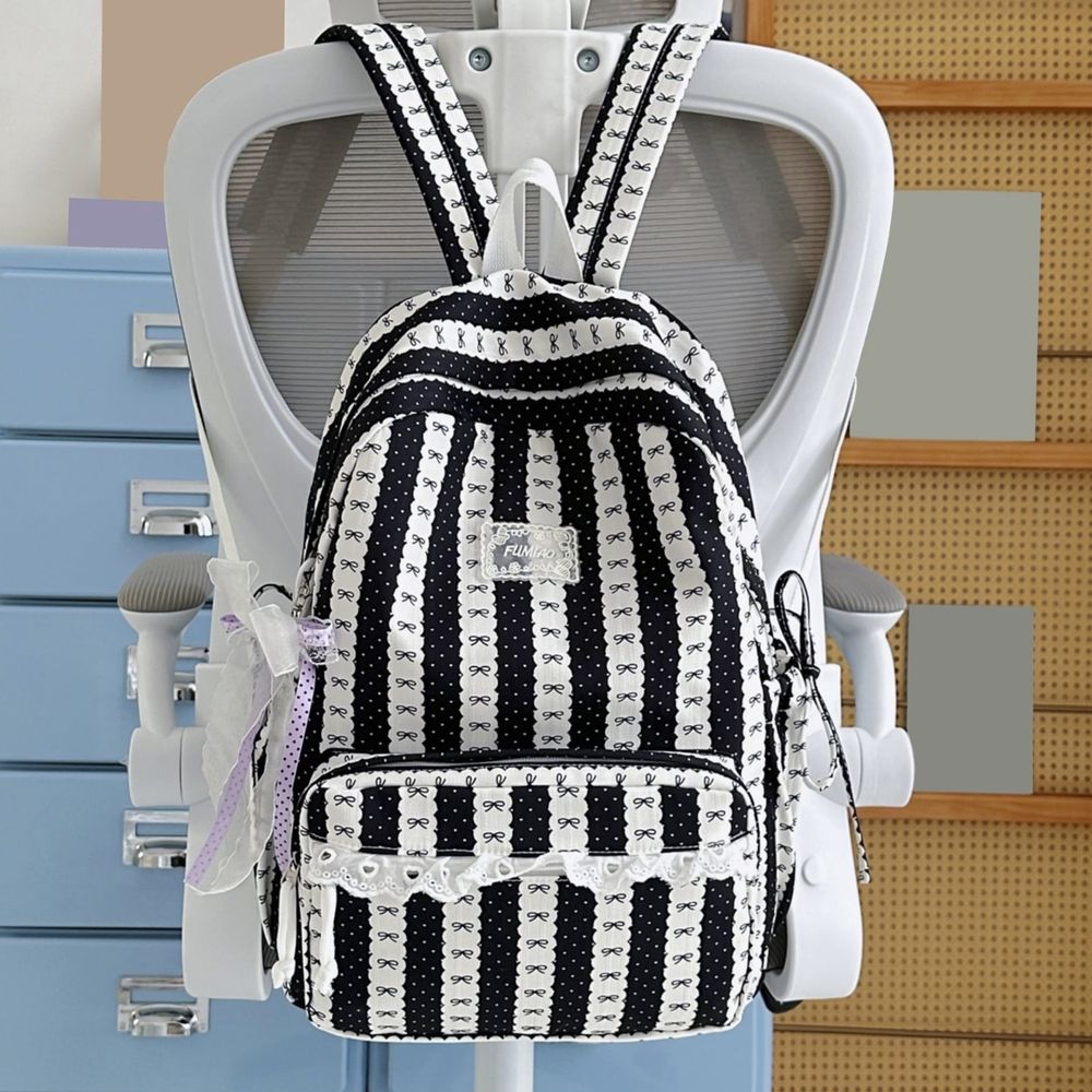 Green stripe school backpack for kids with bowknot, lace trim, spacious design, suitable for travel, college, or daily use.