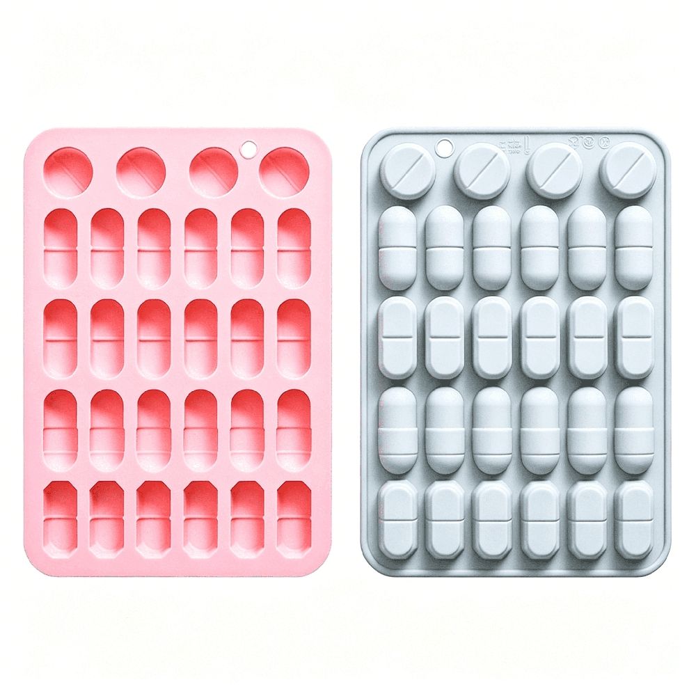 Blue and pink silicone pill mold trays for making capsule-shaped candies, chocolates, gummies, and ice cubes for kids.