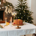 Acacia wood scallop cake stand by Everything Baby, sturdy pedestal display for cakes and cupcakes for any occasion.
