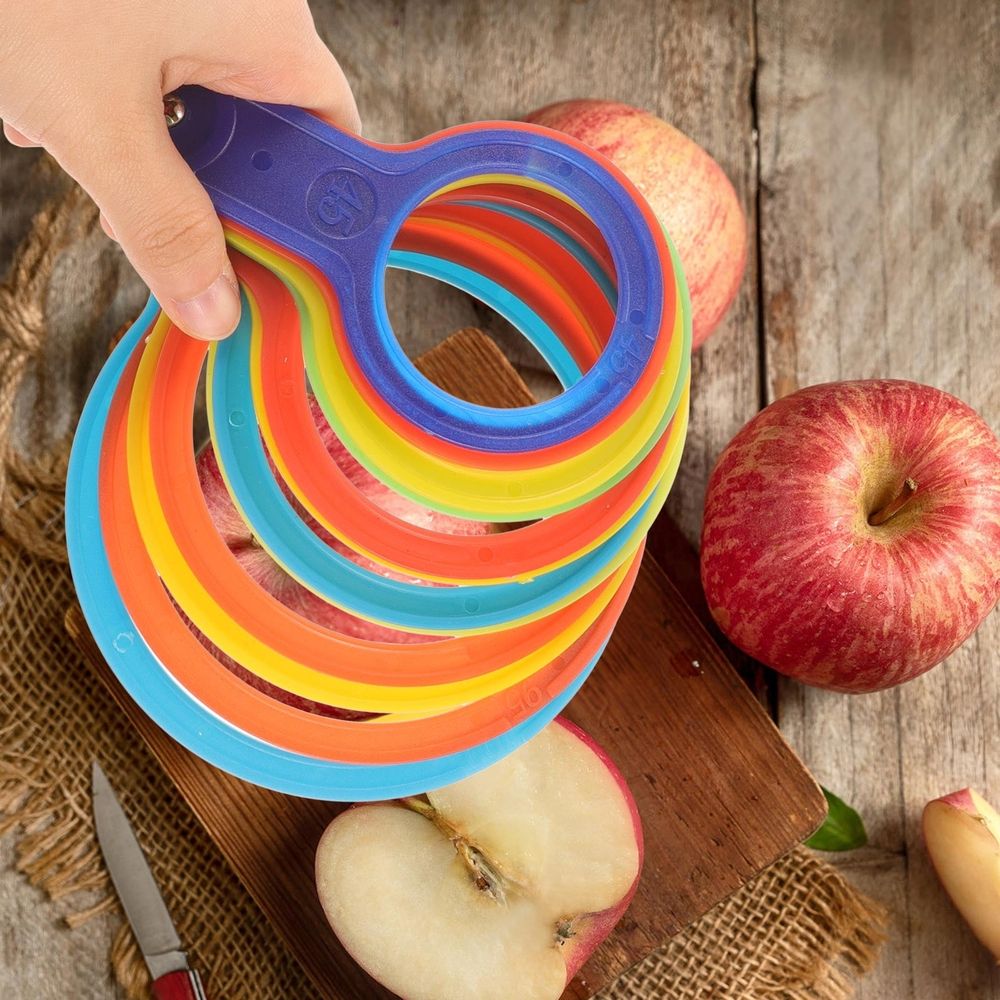 Plastic fruit measuring laps set for babies and kids, includes orange and peach shapes for nursing and feeding use.