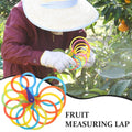 Plastic fruit measuring laps set with orange and peach designs for babies and kids, ideal for nursing and feeding.