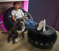 Inflatable gaming chair for kids and teens with cup holders and side pocket, featuring a comfortable, colorful design for gamer room decor.
