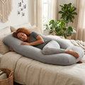 Grey U-shaped pregnancy pillow from Carla Home offers full body support, ideal for nursing and pregnancy comfort.