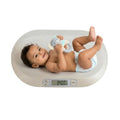 Electronic digital baby scale from Carla Home with LCD display and tare function, designed for accurate baby weight measurement.