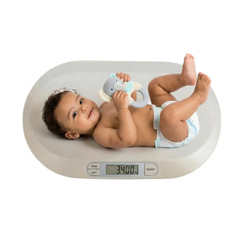 Electronic digital baby scale from Carla Home with LCD display and tare function, designed for accurate baby weight measurement.