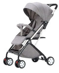 Lightweight black and grey foldable baby stroller in compact travel design, suitable for infants and toddlers, by Everything Baby.