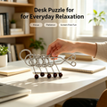 Retro five linked rings puzzle from Everything Baby, a collectible mechanical brain teaser for kids' activity and desktop decor.