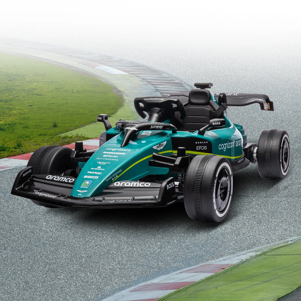 Kids riding a green Kahuna Aston Martin Aramco F1 licensed electric ride-on race car by Everything Baby.