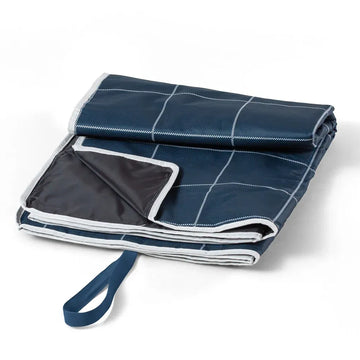 Blue waterproof picnic blanket by Everything Baby, ideal for outdoor meals with kids, featuring a soft, durable surface.