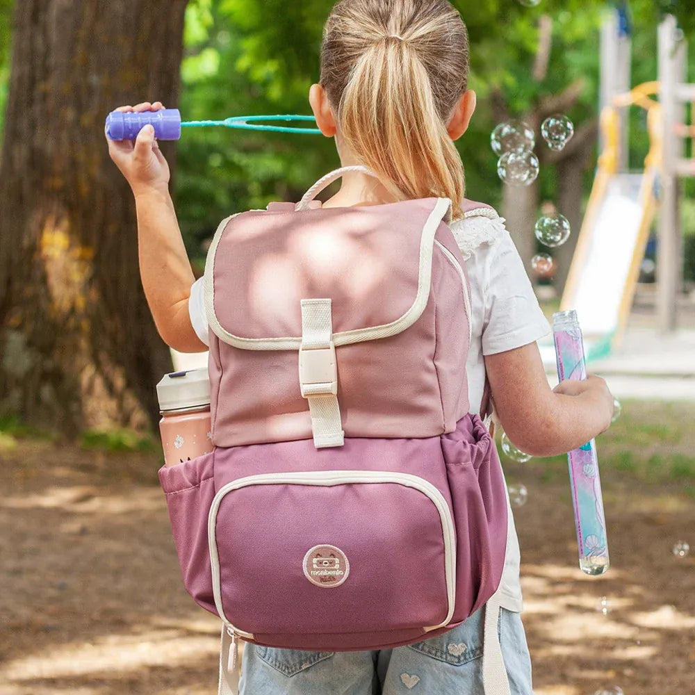 Pink blush Monbento MB The Kids insulated backpack explorer for children, featuring a playful design and adjustable straps.