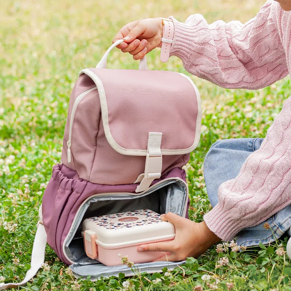 Pink blush Monbento MB The Kids insulated backpack designed for children, featuring a durable, stylish lunch bag with adjustable straps.