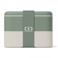 Monbento Flex green kid's lunch box with two compartments and cutlery, designed for children, featuring a natural green color.