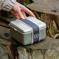 Natural blue Monbento MB Sense L metal lunch box, microwave-safe, designed for kids, with a sleek, durable construction.