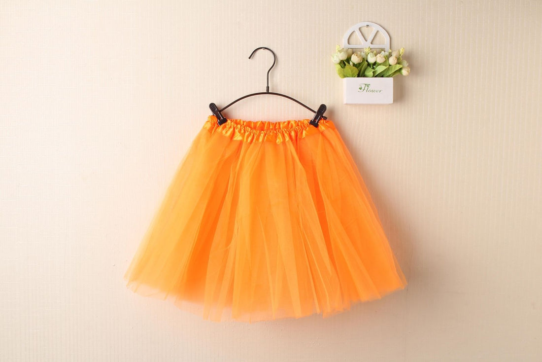 Orange tulle tutu skirt dress for girls and women, perfect for dance and costume dress-up, from Everything Baby.