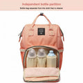 Navy luxury multifunctional diaper nappy backpack by Everything Baby with multiple compartments and stroller attachment for moms and babies.