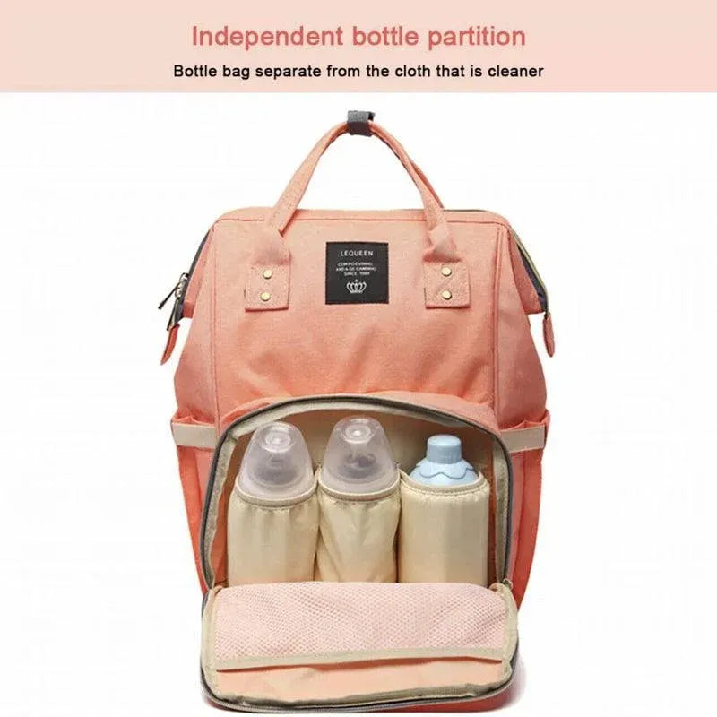 Navy luxury multifunctional diaper nappy backpack by Everything Baby with multiple compartments and stroller attachment for moms and babies.